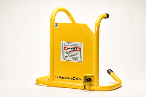 California Immobilizer car wheel boot installed on parked vehicle